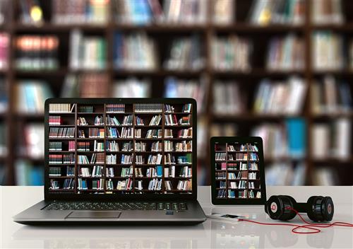 Chromebook with books in the background 
